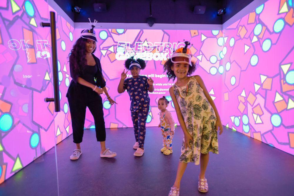 Family playing Immersive Gamebox at Bluewater